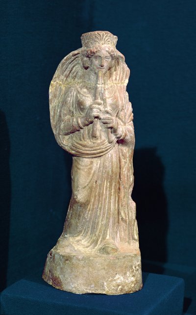 Statuette einer Frau, die eine Doppelflöte spielt, aus Tunesien von Punic